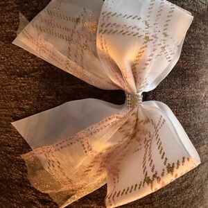 Elegant white bow with pink and gold plaid